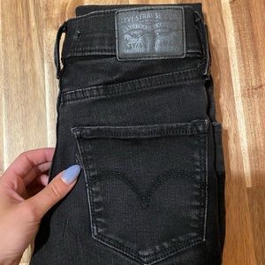 Levi black skinny jeans